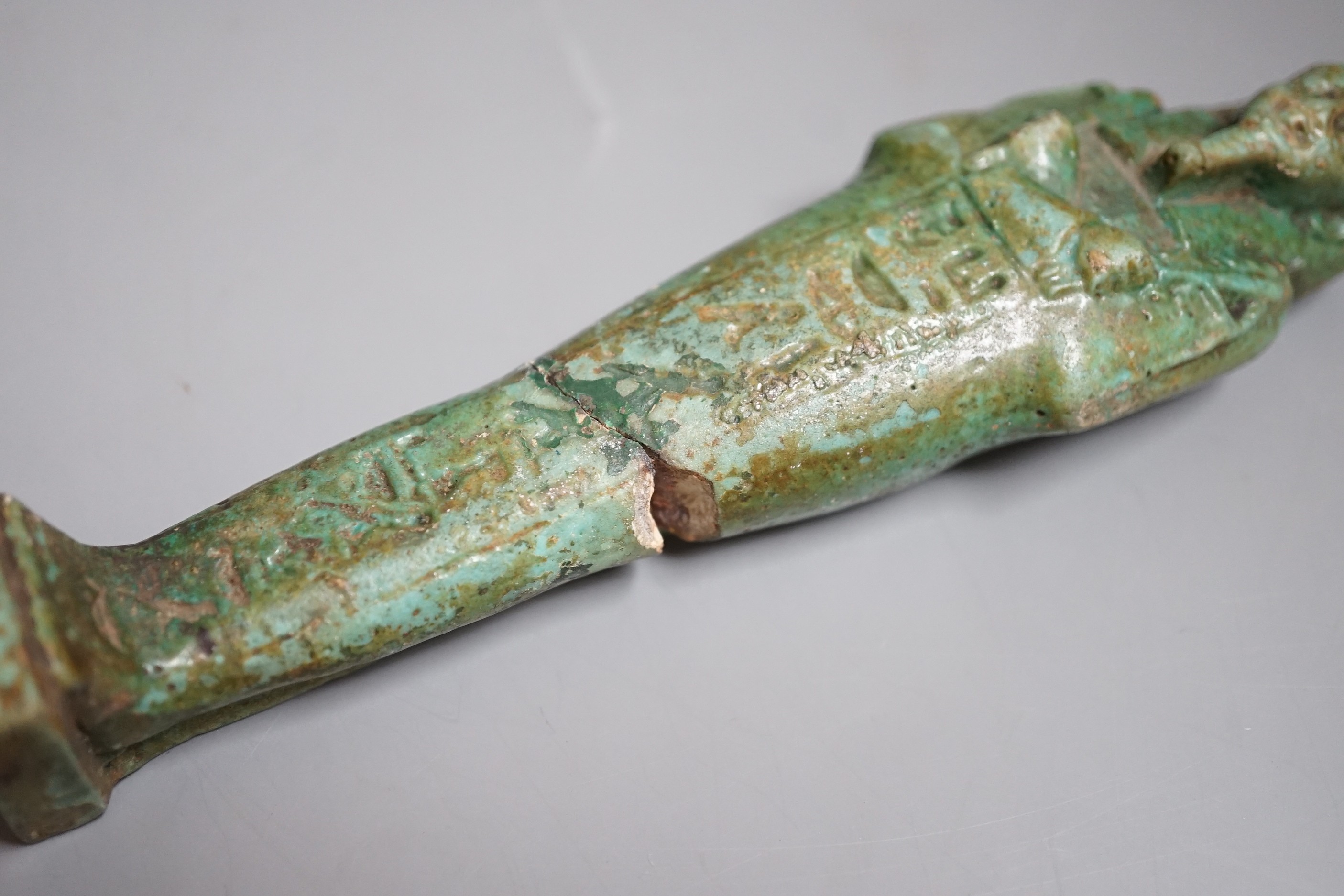 An Egyptian turquoise glazed faience ushabti, possibly Late Kingdom. 14.5cm